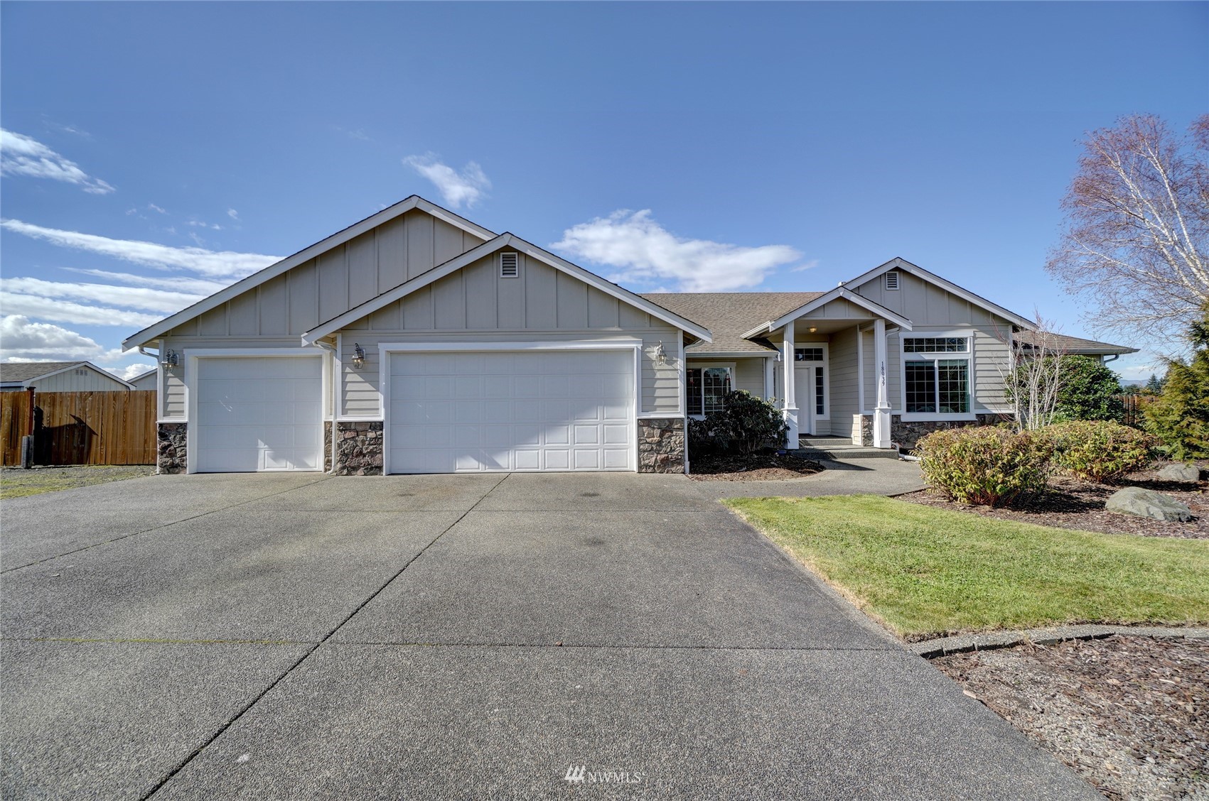 18039 Wild Violet Lane Southwest Rochester, WA 98579 - Photo 1 of 40 a front view of a house with a yard and garage
