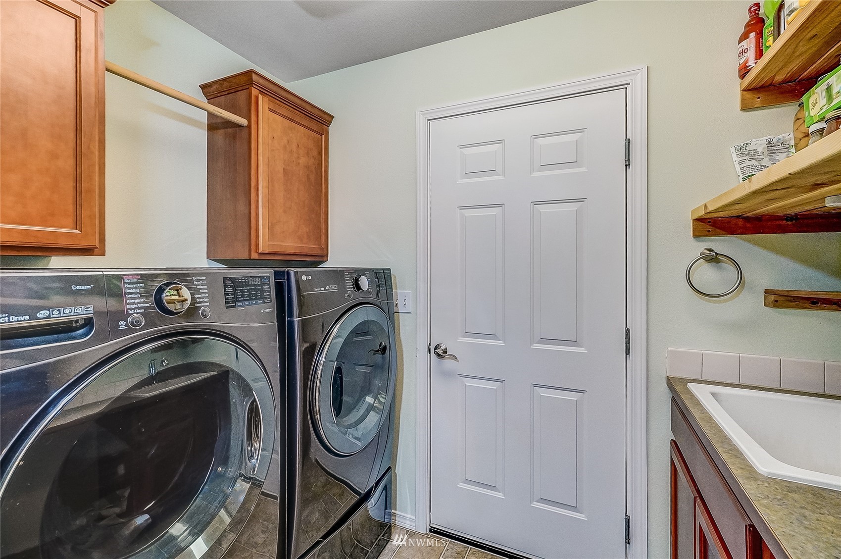18039 Wild Violet Lane Southwest Rochester, WA 98579 - Photo 26 of 40 a utility room with sink dryer and washer