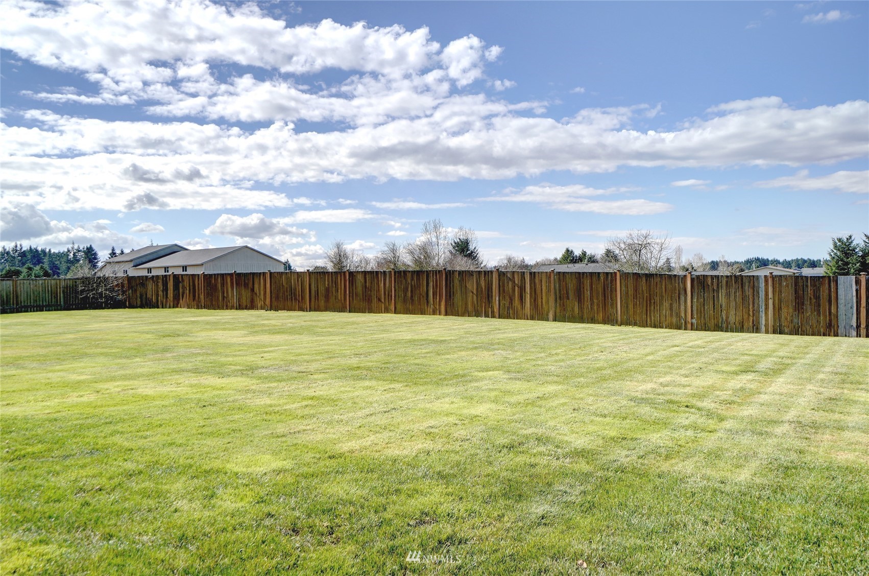 18039 Wild Violet Lane Southwest Rochester, WA 98579 - Photo 33 of 40 a view of swimming pool with outdoor seating and yard in back
