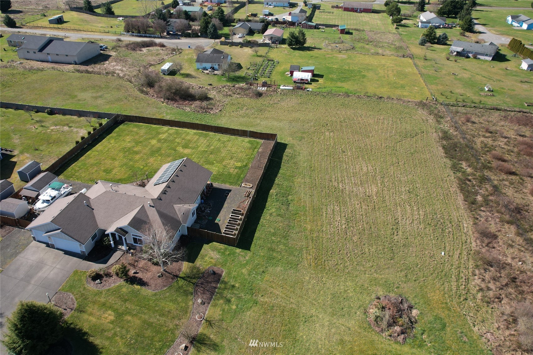 18039 Wild Violet Lane Southwest Rochester, WA 98579 - Photo 40 of 40 an aerial view of a house with a yard