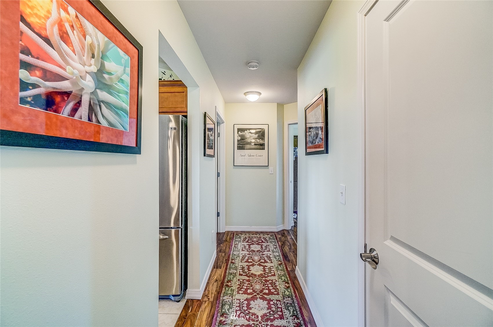 18039 Wild Violet Lane Southwest Rochester, WA 98579 - Photo 7 of 40 a view of a hallway with paintings on the wall