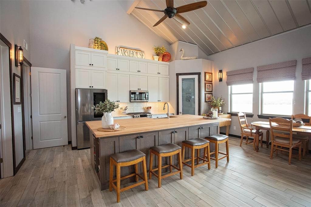 1982 Rocky Mound Road Graham, TX 76450 - Photo 11 of 35 Stainless steel appliances, butcher block counters, lofted ceiling, and a breakfast bar area.