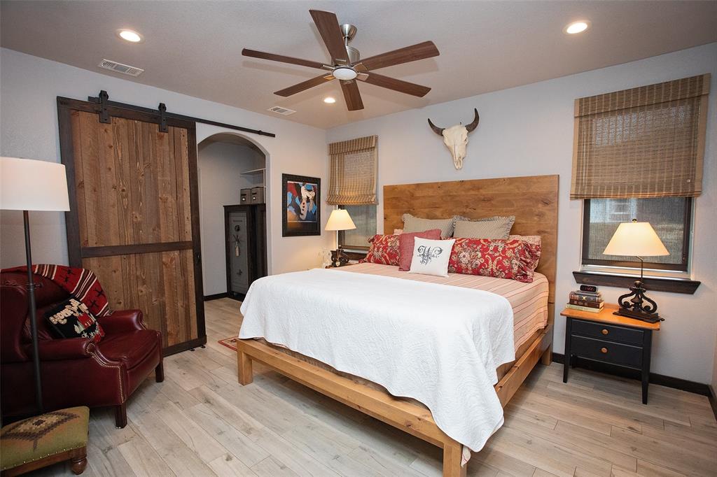 1982 Rocky Mound Road Graham, TX 76450 - Photo 12 of 35 Primary Bedroom is downstairs with dressing area and large ensuite bath.