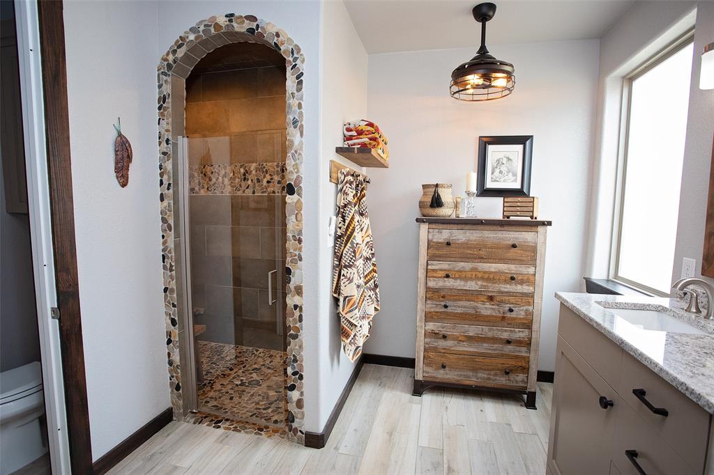 1982 Rocky Mound Road Graham, TX 76450 - Photo 14 of 35 Spacious ensuite Bath. Extra hook up for tub where the dresser sits now.
