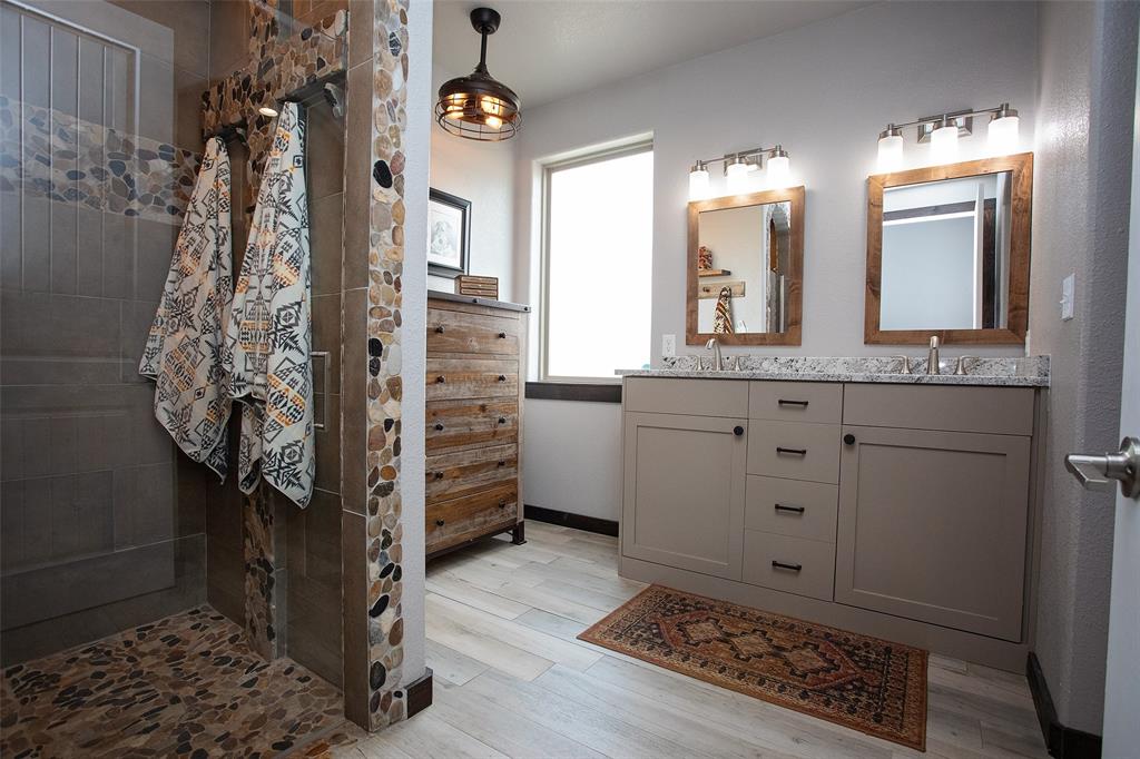 1982 Rocky Mound Road Graham, TX 76450 - Photo 15 of 35 Double sinks with granite top. View from the Toilet closet.