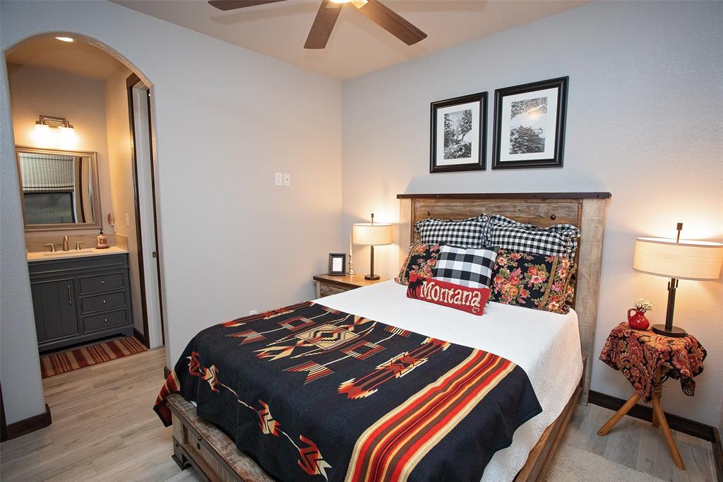 1982 Rocky Mound Road Graham, TX 76450 - Photo 16 of 35 Second Bedroom downstairs with sink area that connects to Tub Shower area with Closet