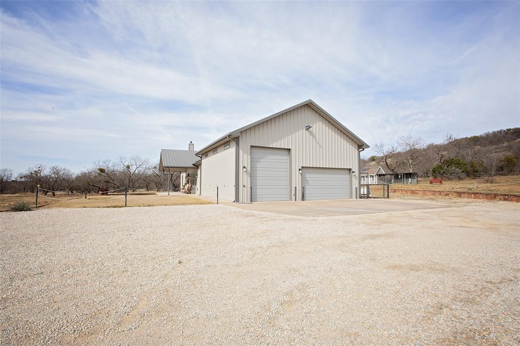 1982 Rocky Mound Road Graham, TX 76450 - Photo 25 of 35 Climate controlled Massive Garage for vehicles, plenty of space for those motorized toys, tools and even has a Basketball court set up.
