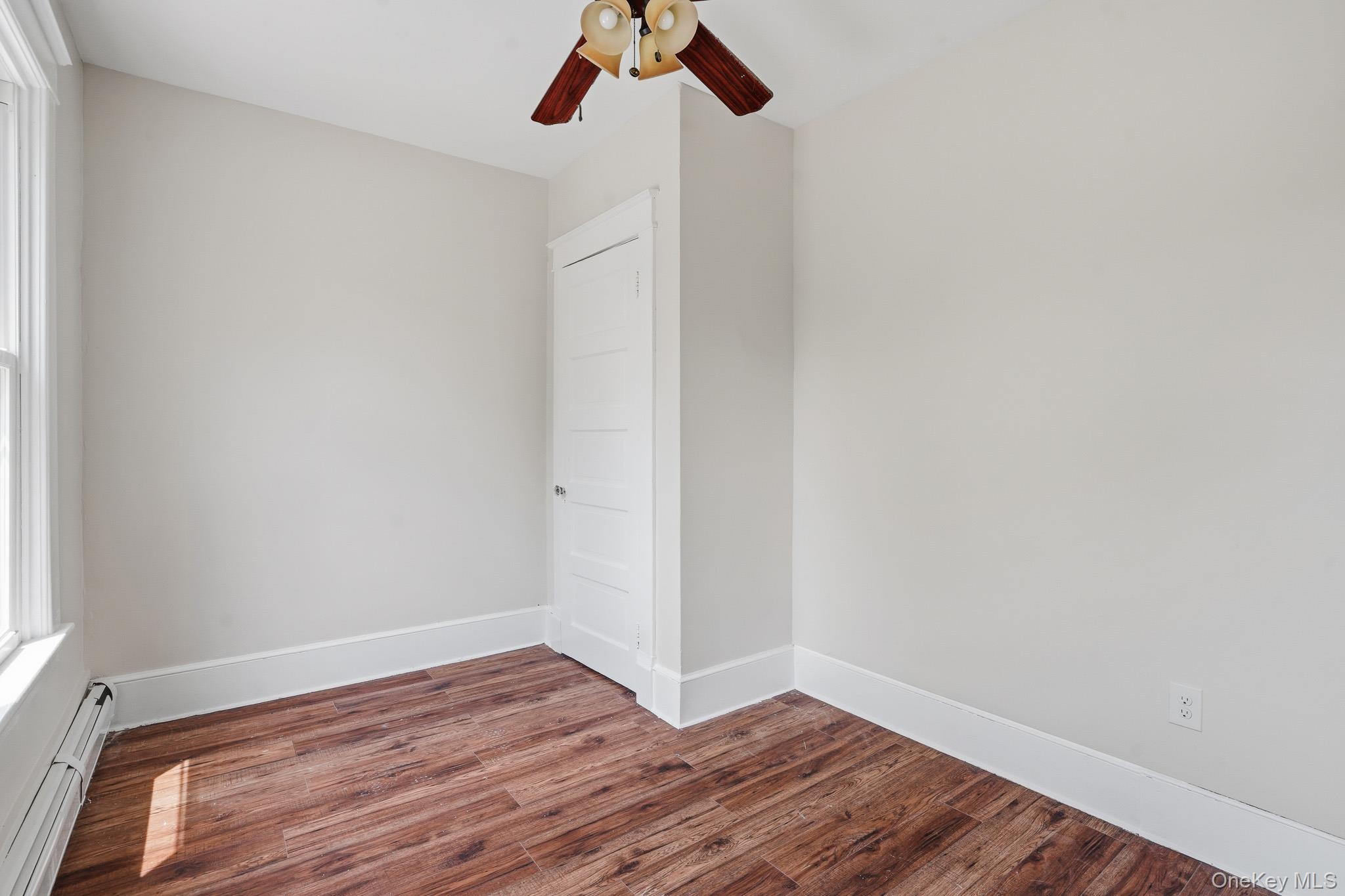 65 North Clinton Street Poughkeepsie, NY 12601 - Photo 30 of 43 a view of room with hardwood floor and window