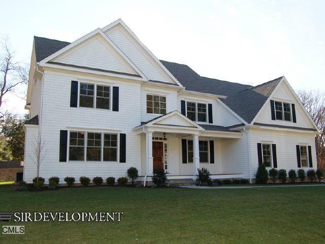 12 Dover Road Westport, CT 06880 - Photo 1 of 1 a front view of a house with a garden