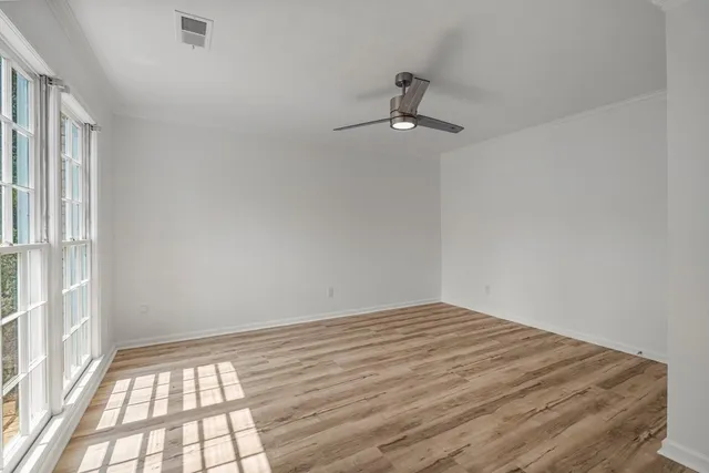 a view of empty room with windows