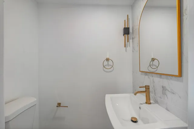 a bathroom with a sink and toilet