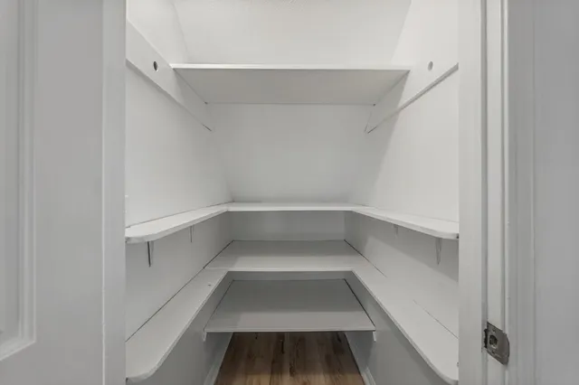 a view of a hallway with white walls