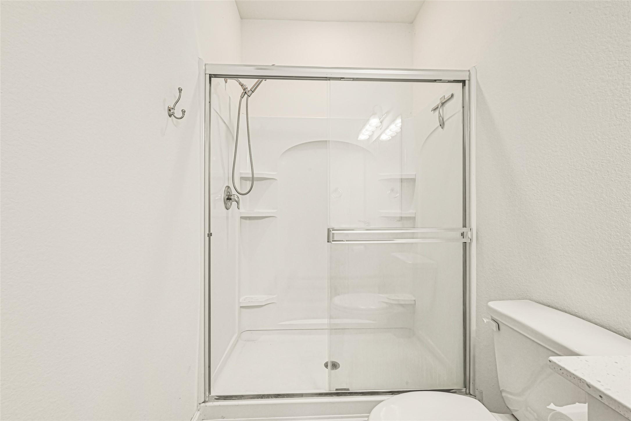 7311 Roseshine Drive Houston, TX 77049 - Photo 17 of 26 Bathroom shower featuring a clean, contemporary finish.