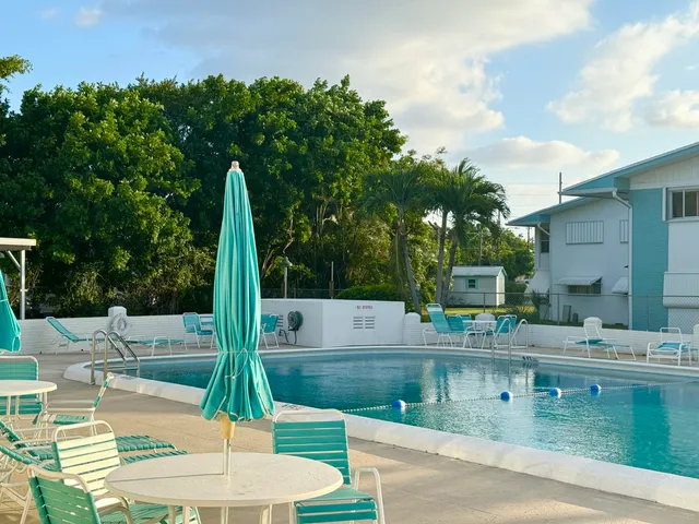 a view of a swimming pool with a patio