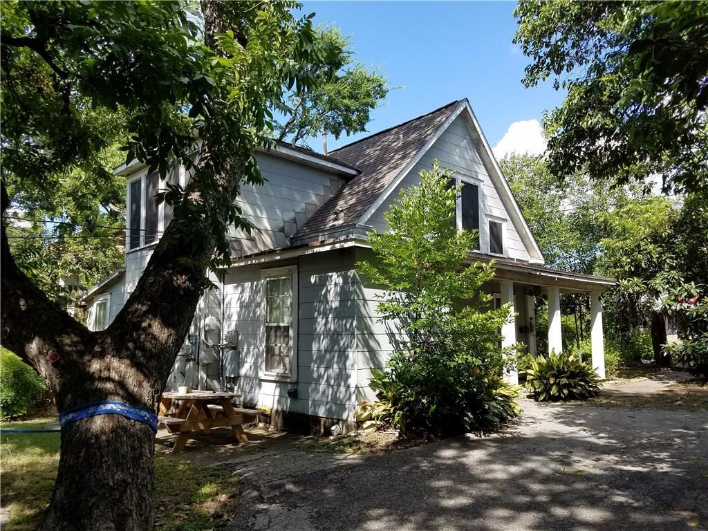 3205 Guadalupe Street, Unit A Austin, TX 78705 - Photo 1 of 17 a view of house with a tree in front