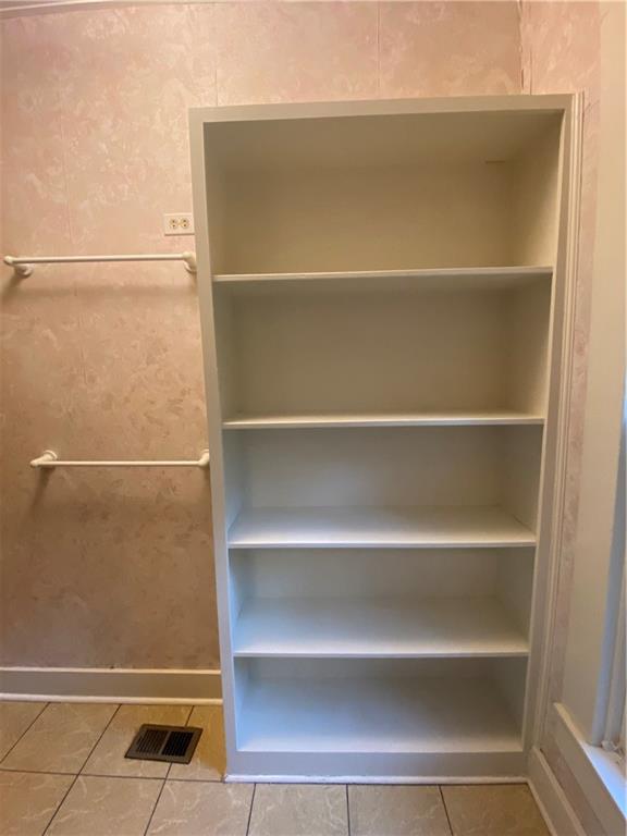 3205 Guadalupe Street, Unit A Austin, TX 78705 - Photo 11 of 17 a view of walk in closet with empty racks