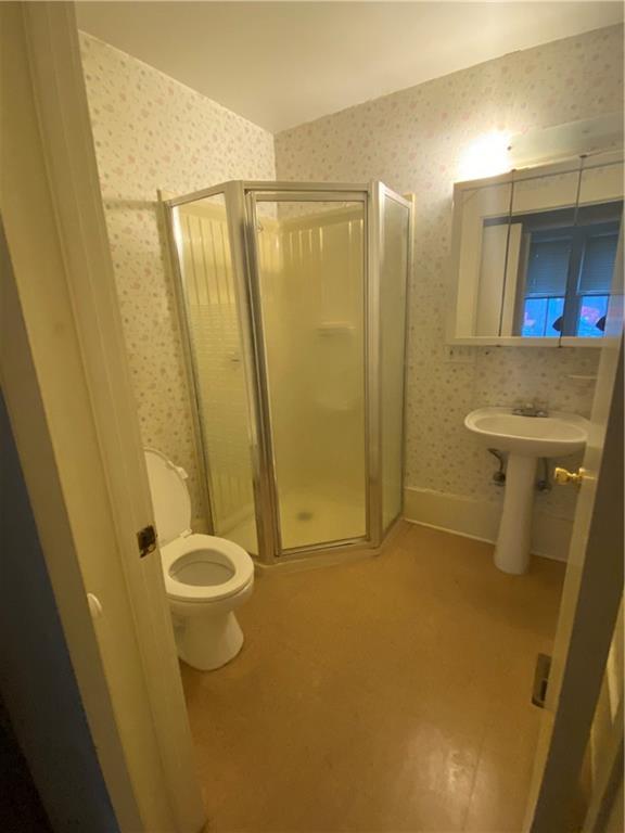 3205 Guadalupe Street, Unit A Austin, TX 78705 - Photo 13 of 17 a bathroom with a shower and a sink