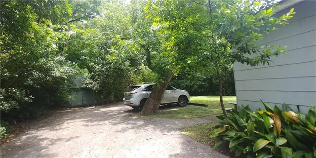 a view of a backyard with sitting area