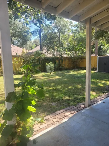 a view of house with yard