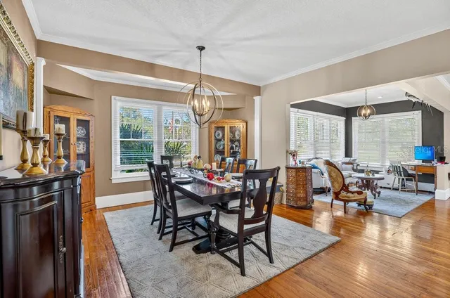 a large kitchen with stainless steel appliances granite countertop a sink window and cabinets