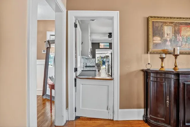 a kitchen with granite countertop a sink a stove and cabinets