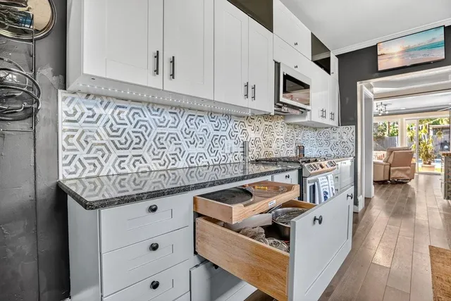 a view of a bathroom with a sink and mirror