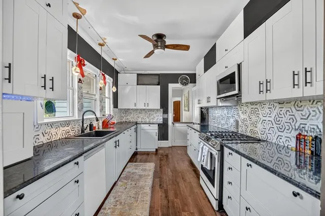 a bathroom with a sink a toilet and bathtub