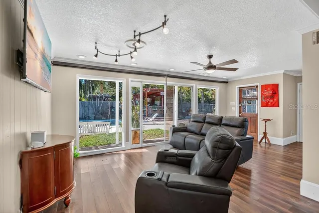 a bedroom with furniture and a wooden floor