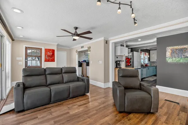 a room with a window and a table chair