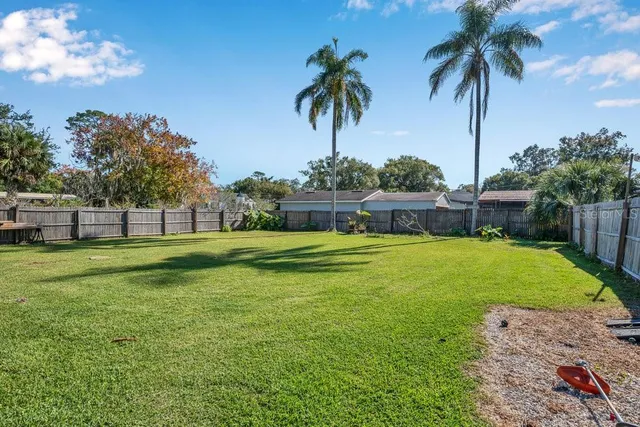 a view of a swimming pool with an outdoor space and seating area