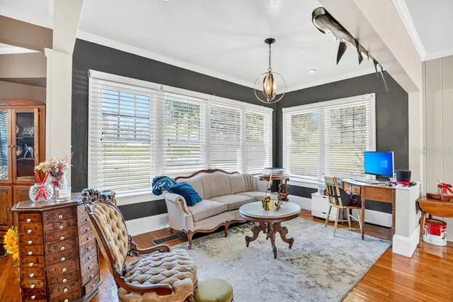 a view of a dining room with furniture window and wooden floor