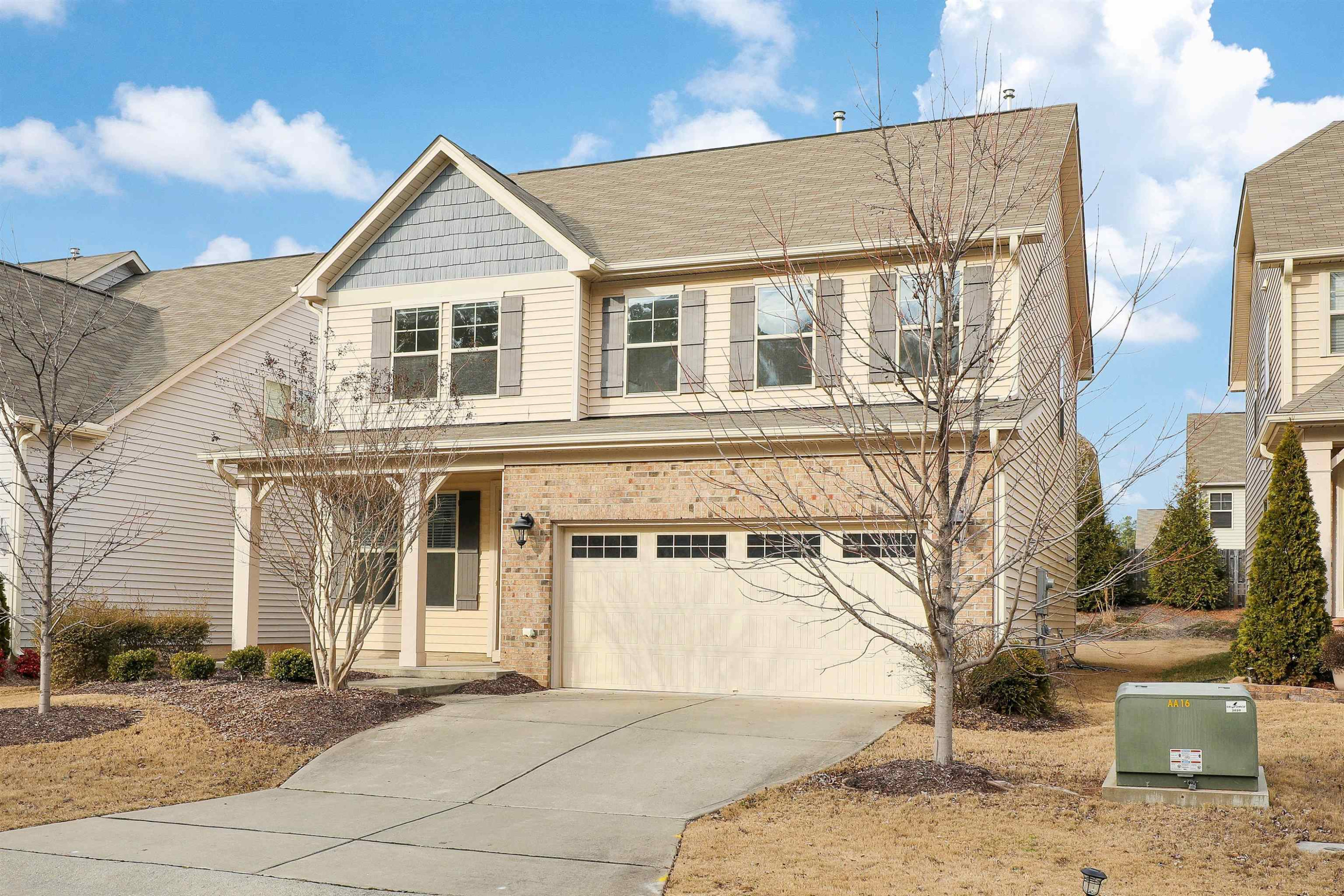 3413 Flat River Drive Durham, NC 27703 - Photo 2 of 40 a view of a white house with large windows next to a road