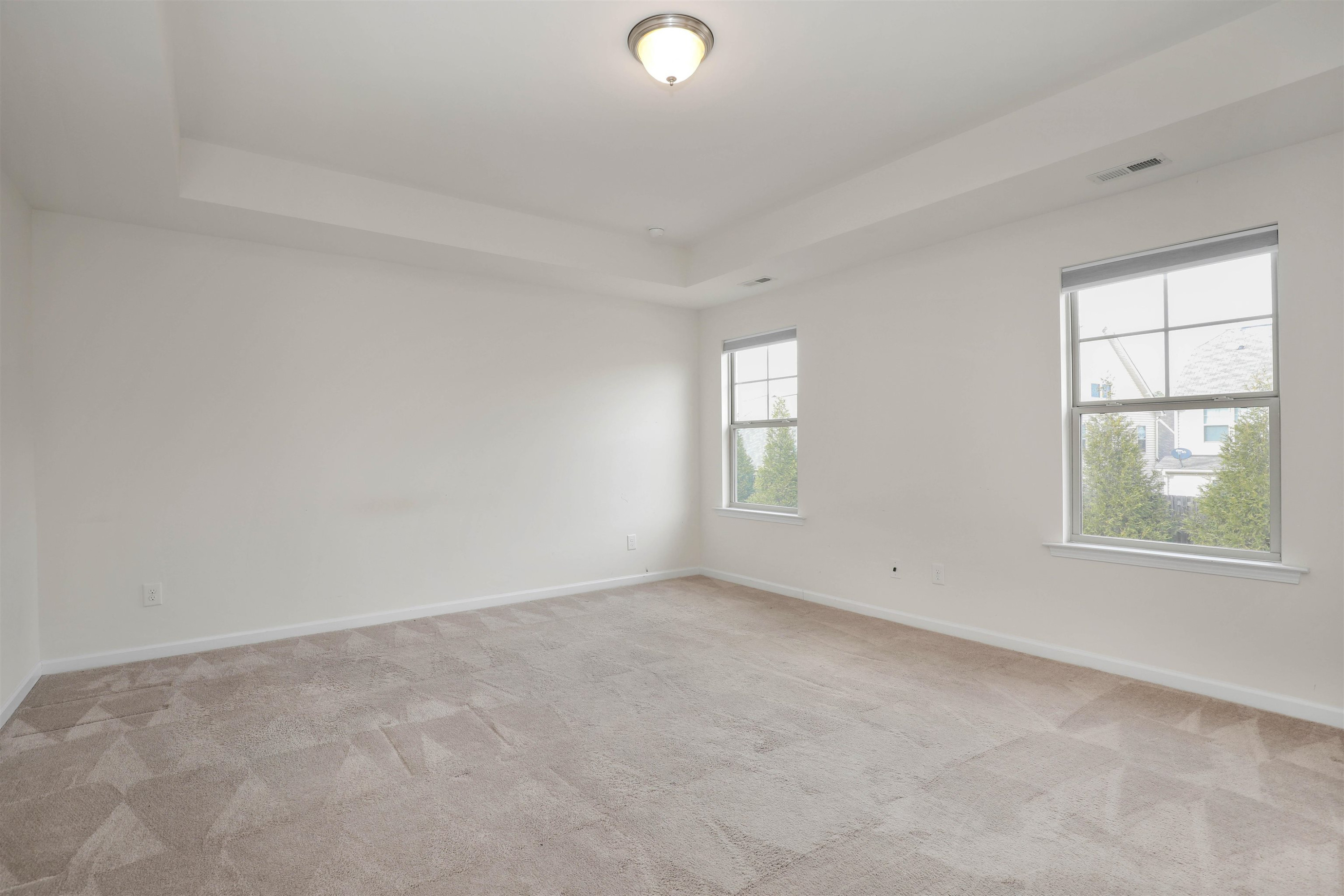 3413 Flat River Drive Durham, NC 27703 - Photo 21 of 40 an empty room with windows