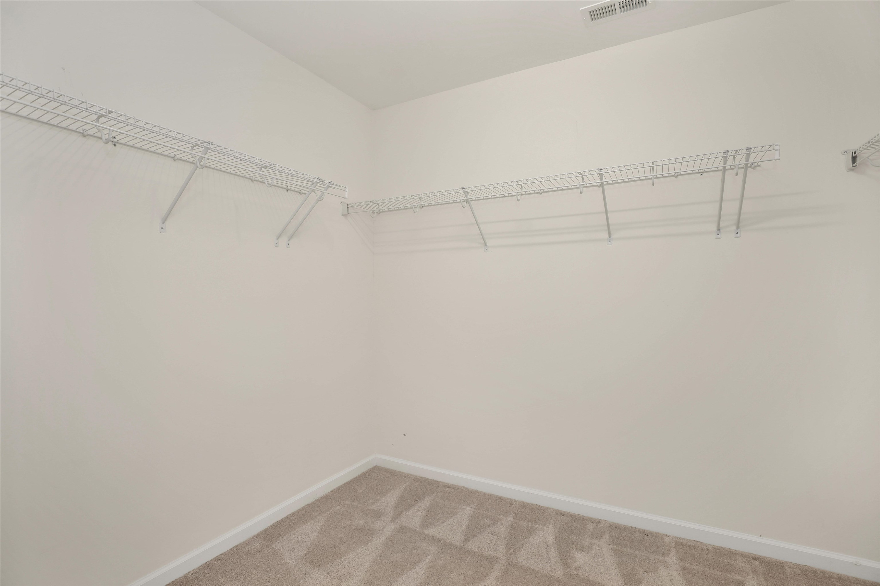 3413 Flat River Drive Durham, NC 27703 - Photo 27 of 40 a view of a room with racks on the wall