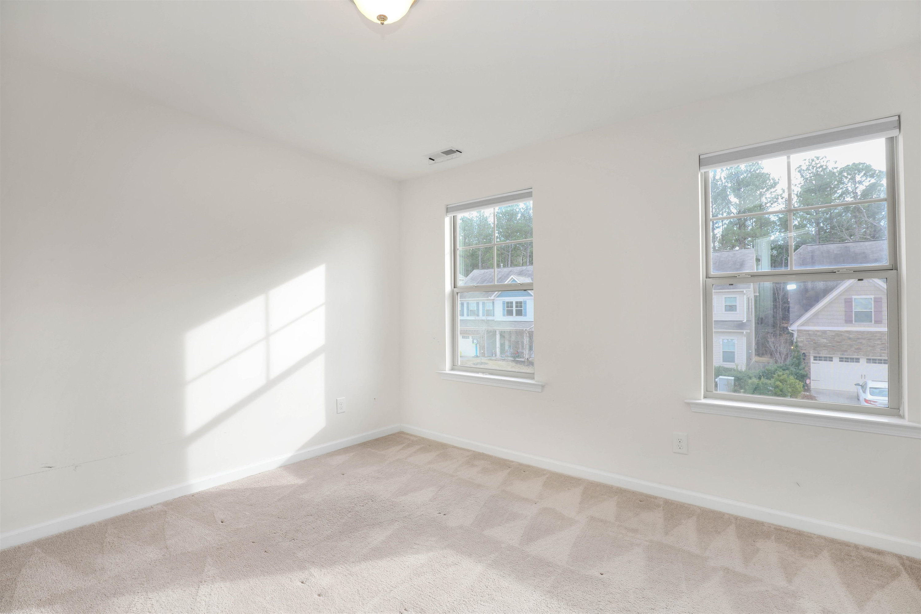 3413 Flat River Drive Durham, NC 27703 - Photo 30 of 40 an empty room with windows