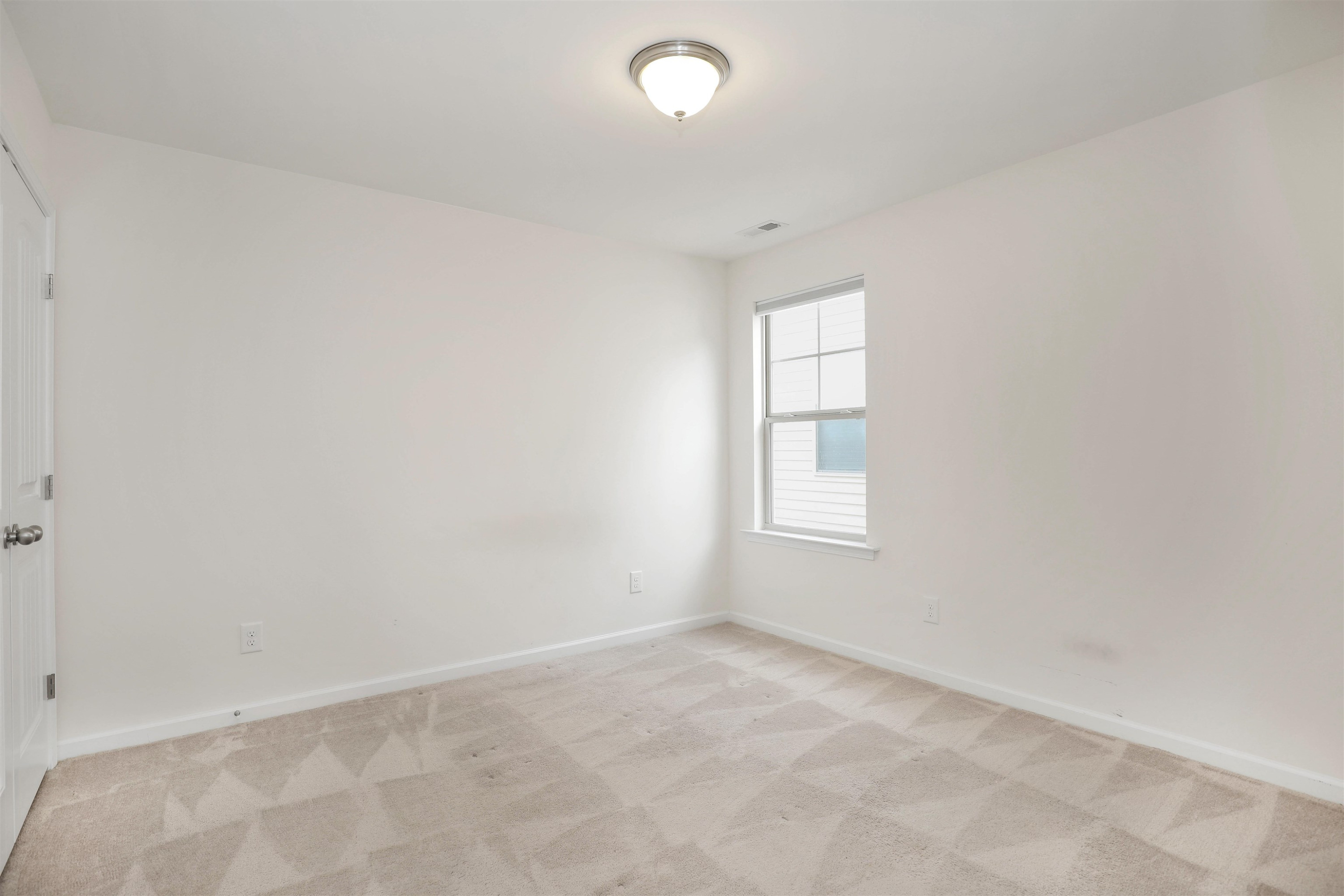 3413 Flat River Drive Durham, NC 27703 - Photo 31 of 40 an empty room with windows and closet