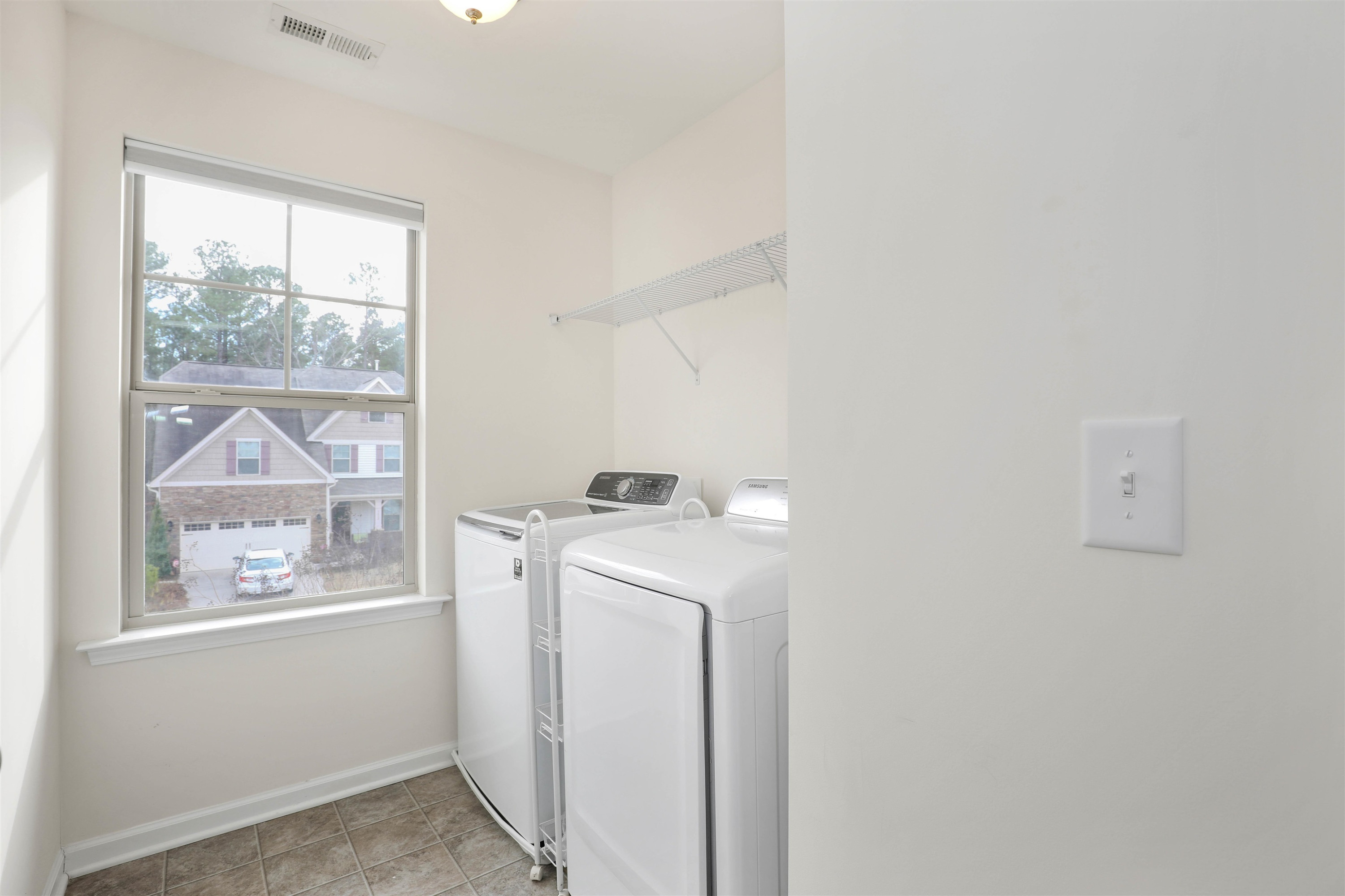 3413 Flat River Drive Durham, NC 27703 - Photo 33 of 40 a utility room with dryer and washer