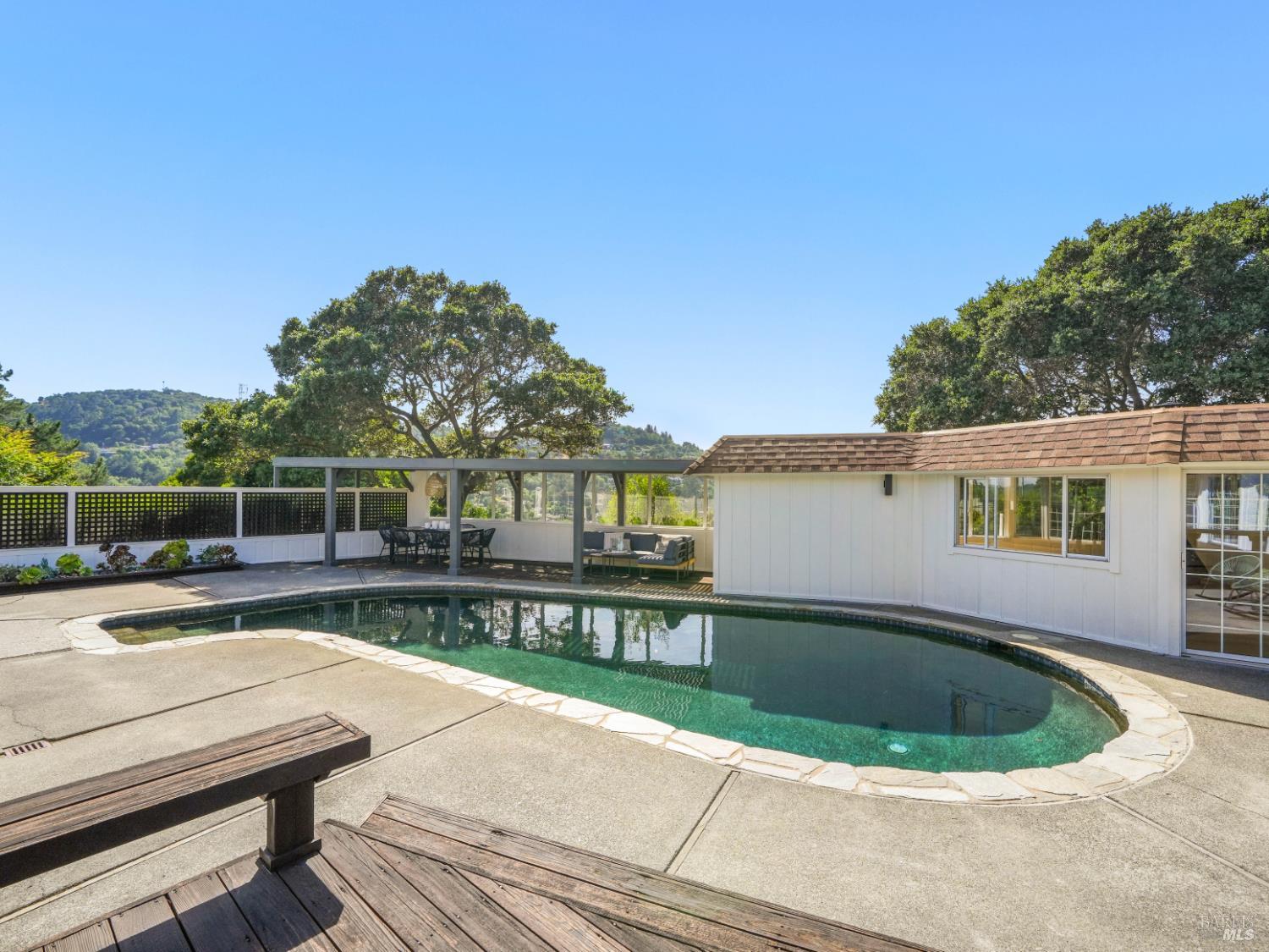 148 Dominican Drive San Rafael, CA 94901 - Photo 45 of 60 a view of a house with pool fire pit tables and chairs