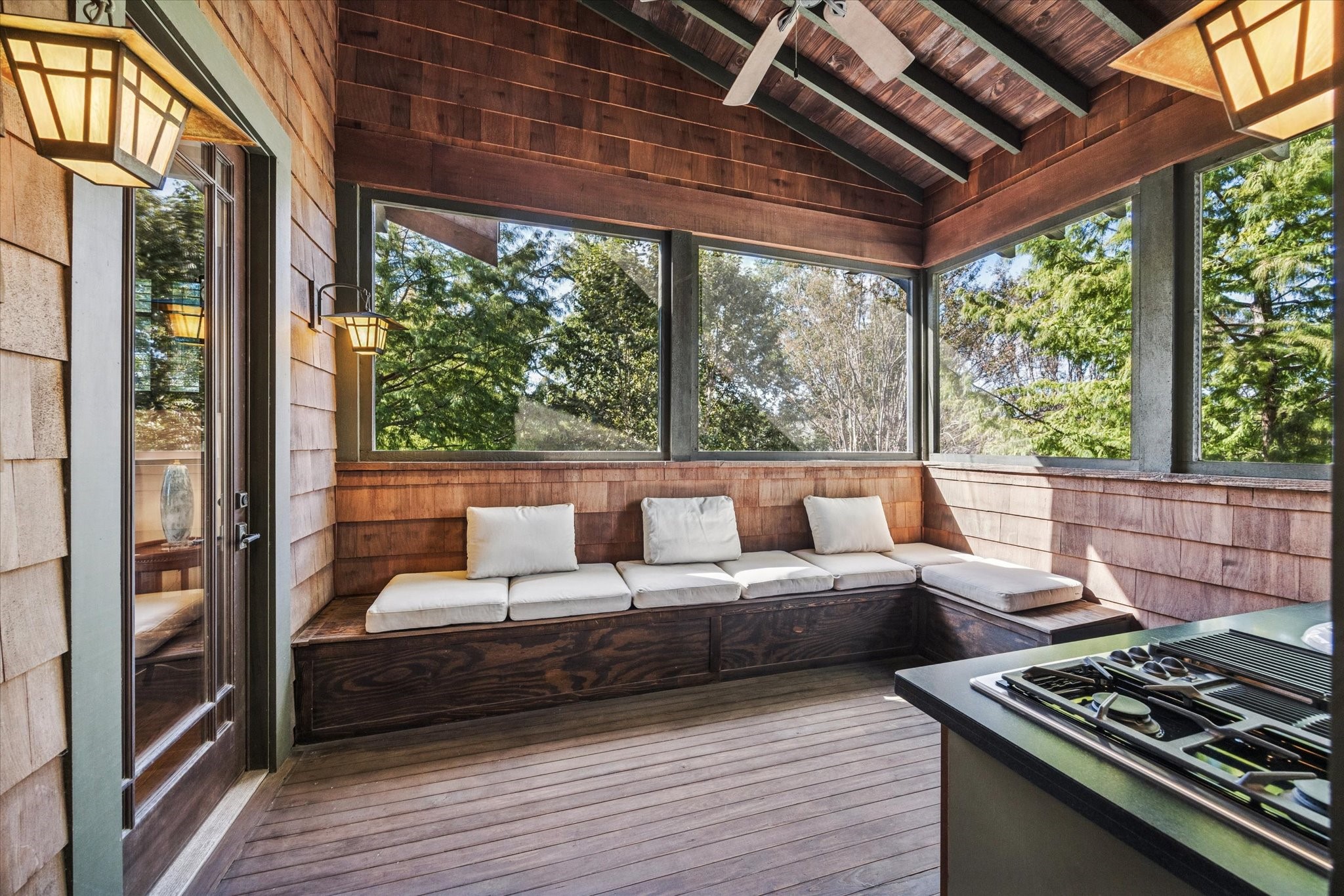 512 Archer Street Houston, TX 77009 - Photo 26 of 40 Surrounding the screened porch, built-in benches with storage create cozy spots to unwind while taking in the treetop views.