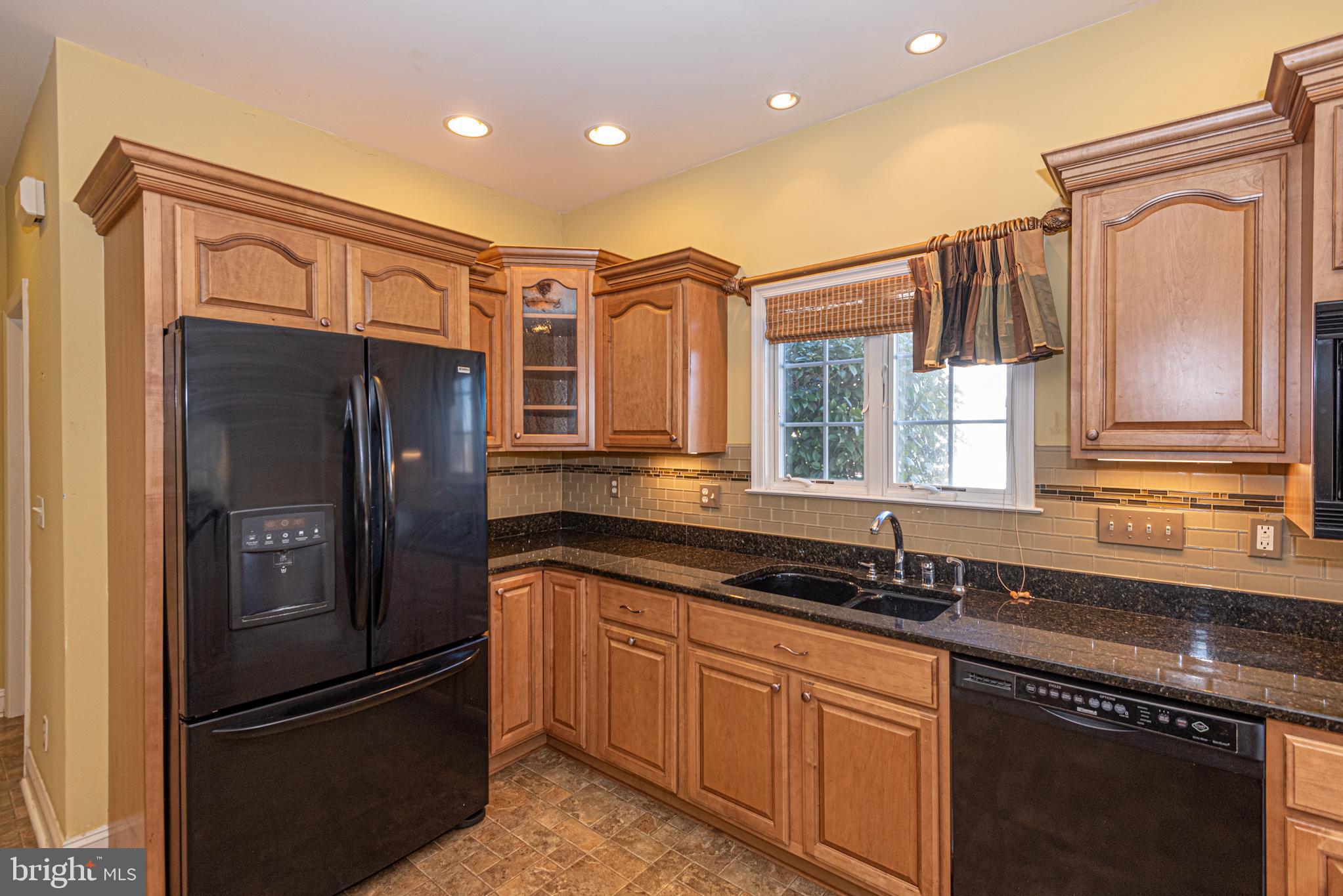 6023 Tarry Town Road Salisbury, MD 21801 - Photo 15 of 61 Charming kitchen with warm wood accents.