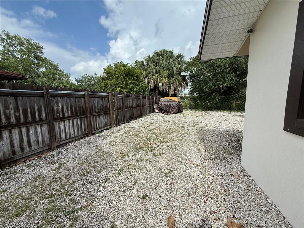 1964 42nd Street Southwest Naples, FL 34116 - Photo 24 of 25 a view of a backyard