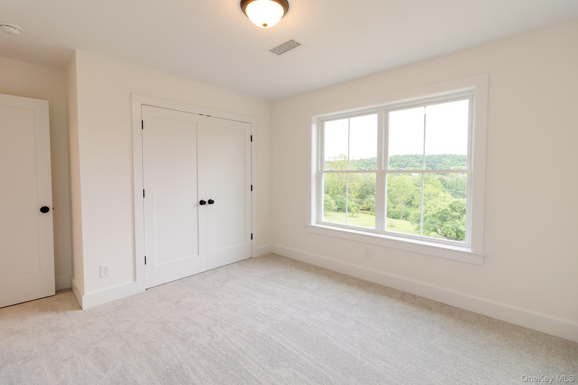 750 Ridgebury Road Slate Hill, NY 10973 - Photo 35 of 41 a view of an empty room with a window
