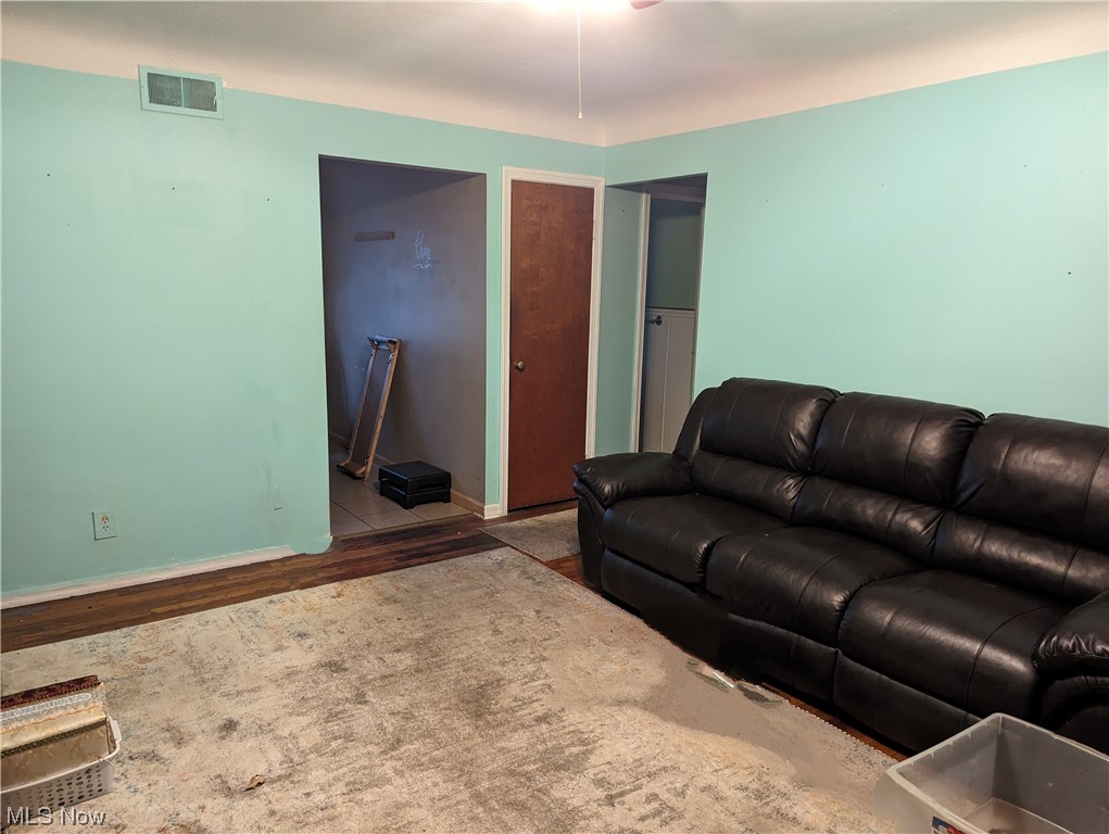 Living room with wood-type flooring