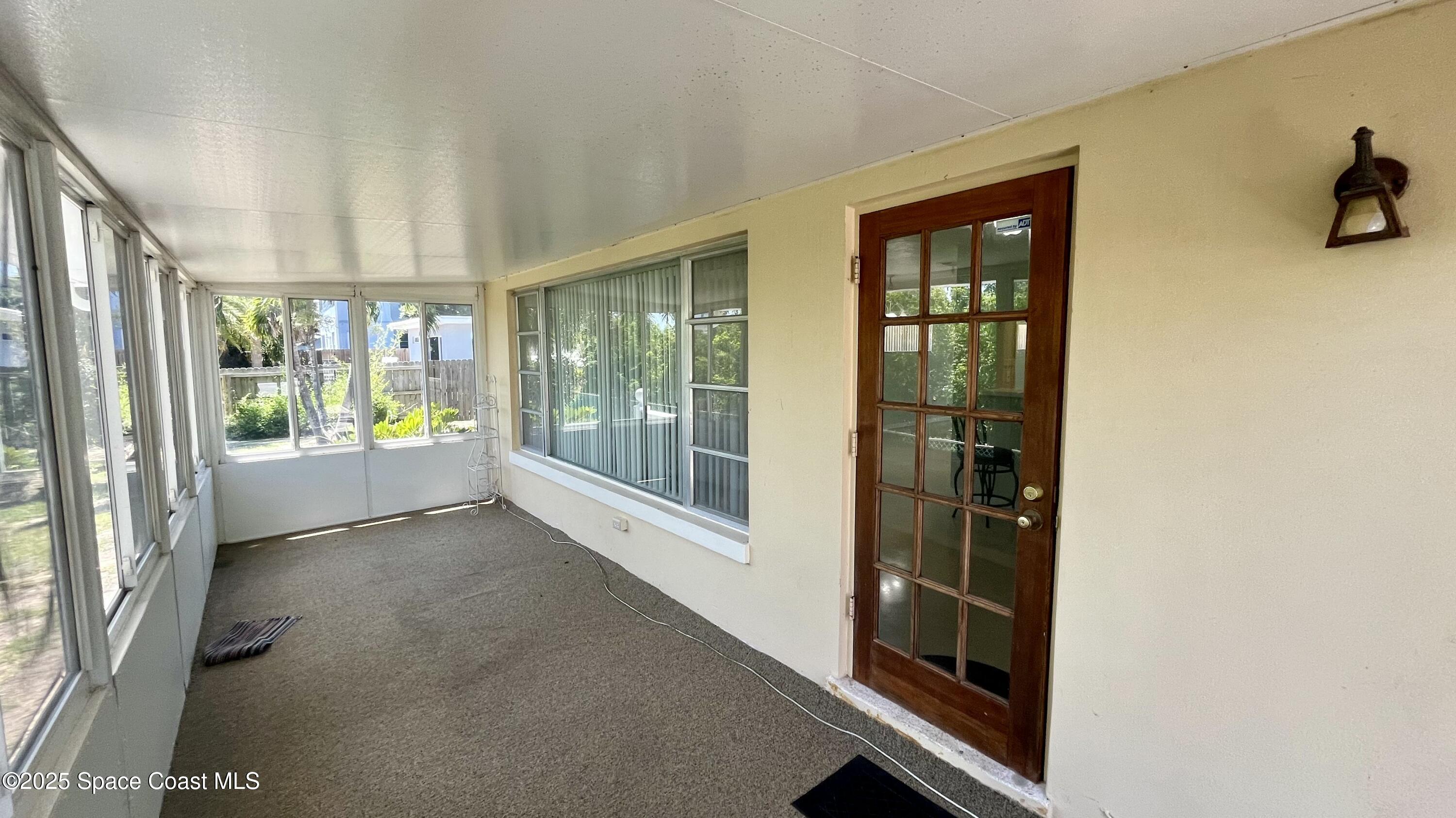 7181 Blue Shore Road Grant, FL 32949 - Photo 25 of 40 a view of an entryway with wooden floor
