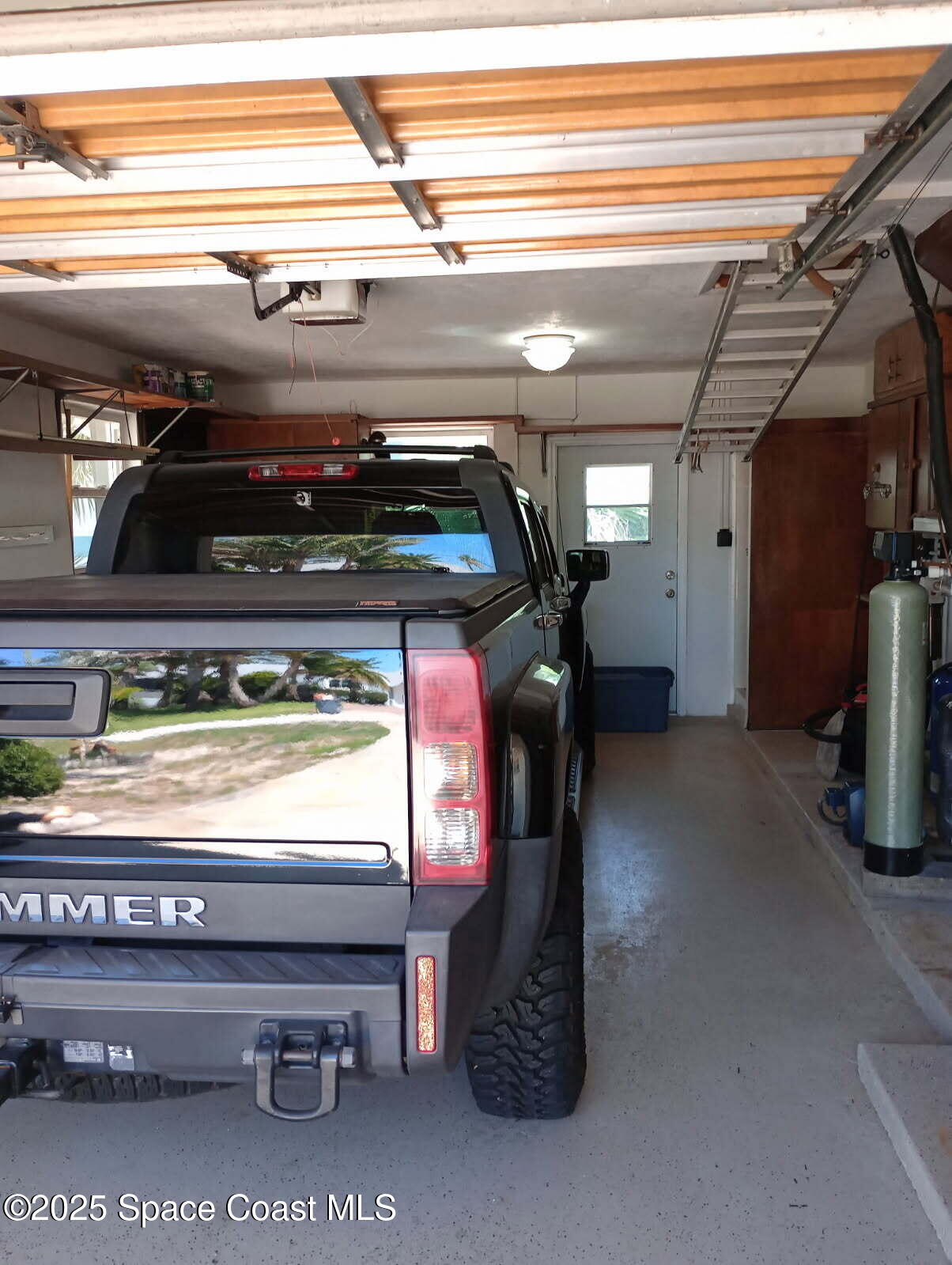 7181 Blue Shore Road Grant, FL 32949 - Photo 27 of 40 a close view of water heater room with washer and dryer
