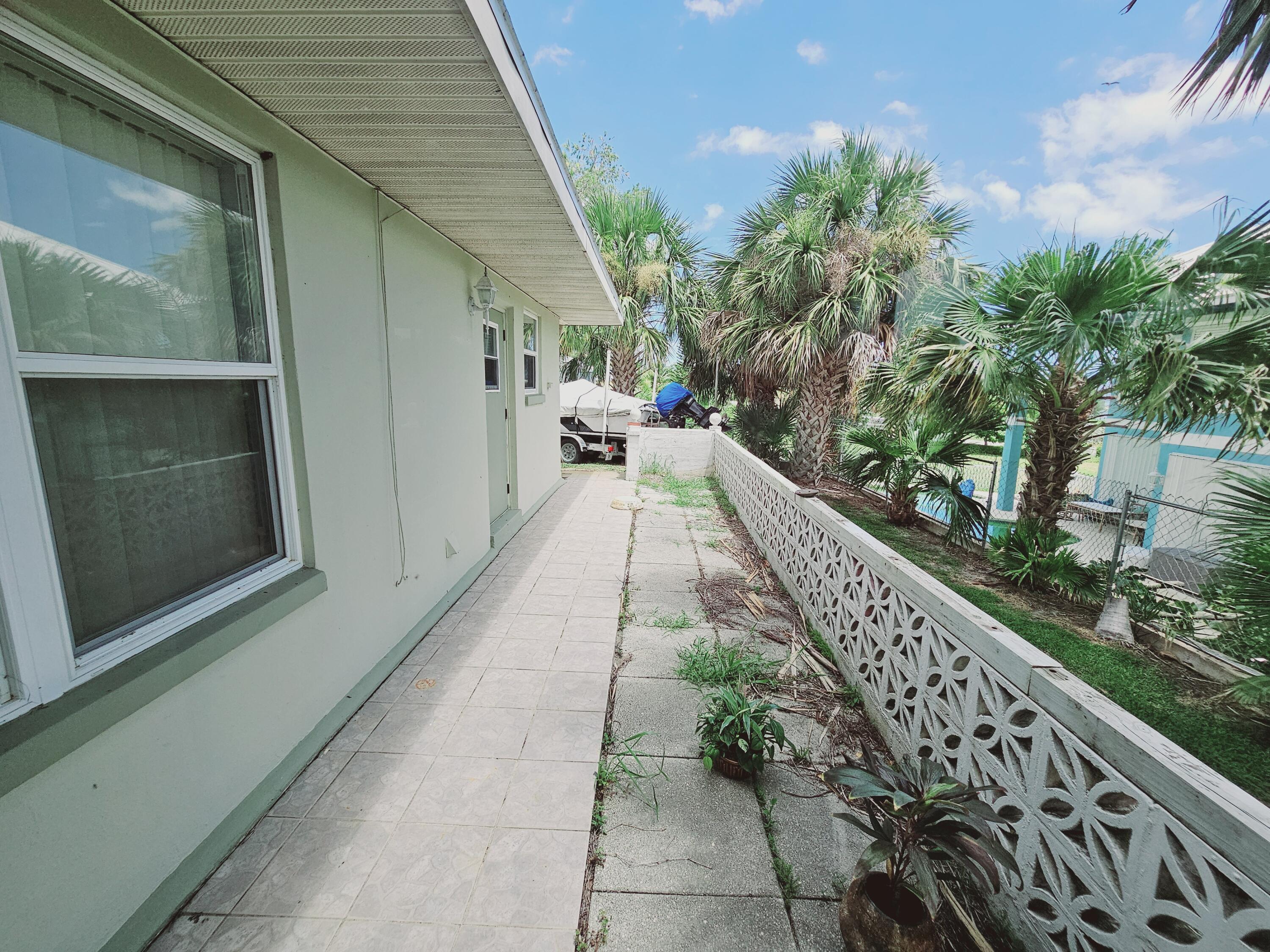 7181 Blue Shore Road Grant, FL 32949 - Photo 30 of 40 a narrow alley leading to a building