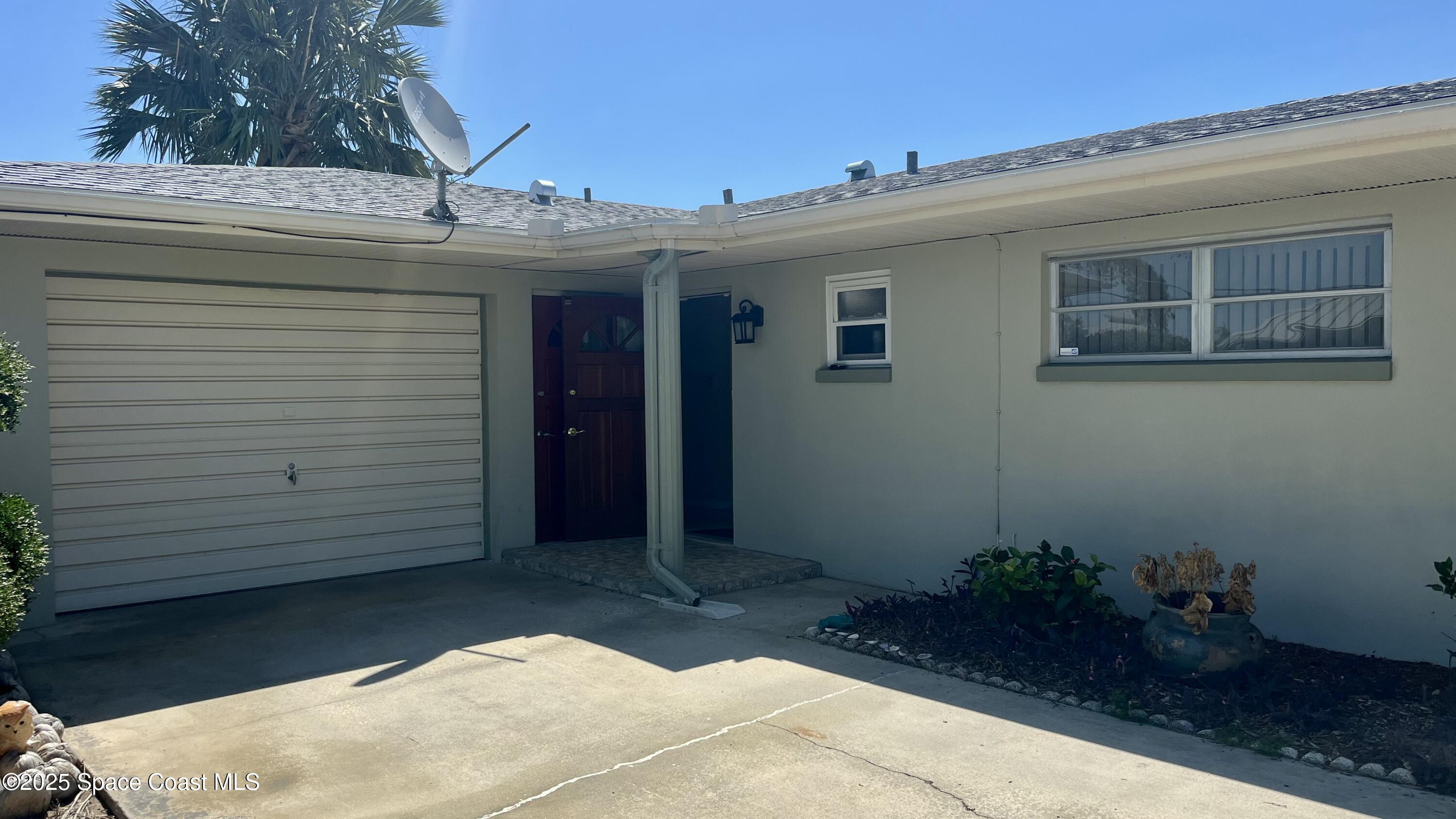 7181 Blue Shore Road Grant, FL 32949 - Photo 33 of 40 a view of a house with a potted plant
