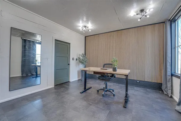 a view of a workspace with furniture