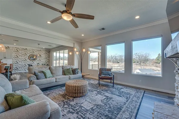 a living room with furniture and a large window
