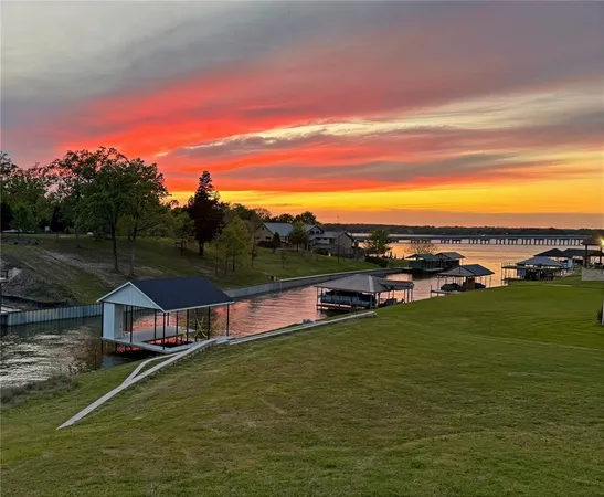 a view of a lake with a yard